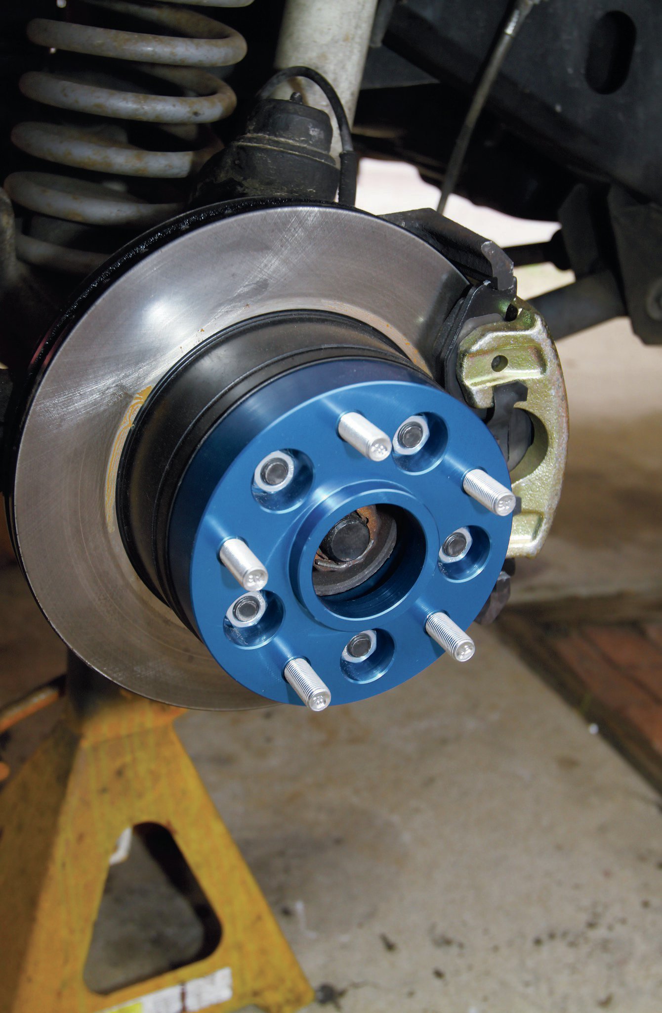 The only piece left to this puzzle was how to get the wheels bolted to the Jeep. The XHD wheels are currently only available in a 5-on-5.5-inch bolt pattern, and the ZJ is still running the factory 5-on-4.5-inch bolt pattern. Problem solved with these 11⁄4-inch-wide spacer/adapters from Spidertrax. Not only do they allow us to put the JK-spec wheels on the ZJ, but they help bring the overall backspacing to something closer to what we were looking for in the first place.