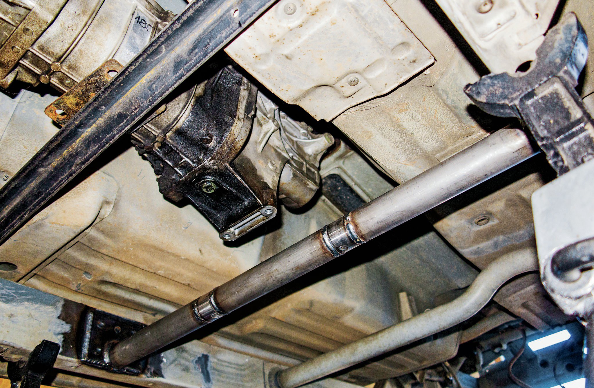 Haines built a crossmember out of 13⁄4x0.156-wall tubing to mount the front suspension links. Since the crossmember is under the transmission, tube clamps from Trail-Gear were added to service the drivetrain.