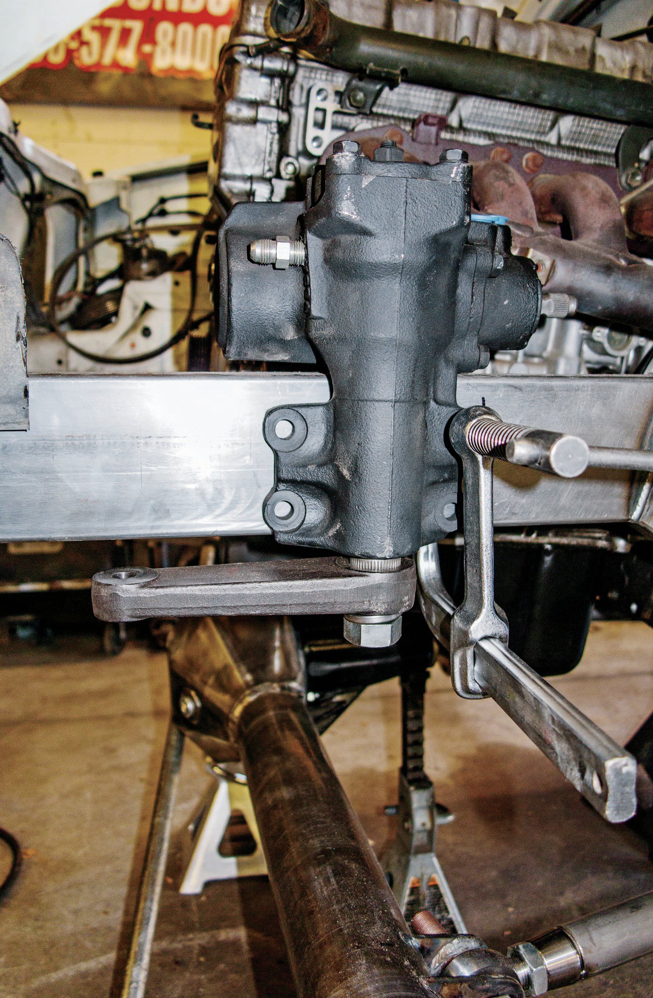 An FJ60 steering box was sourced from Trail-Gear. This Toyota box is much more robust than anything Suzuki ever offered, and unlike a more common Toyota pickup steering box, the pitman arm faces forward on the FJ60 box. This positions the drag link forward for increased clearance with the suspension components.