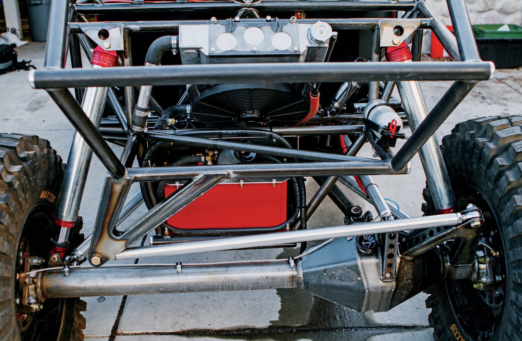 Haines’ rockcrawling buggy uses an offset rear differential and a three-link rear suspension with a track bar. We plan to mimic this setup on our Tracker. Note how much longer the track bar bracket is than a typical Jeep suspension. This increases the roll center of the vehicle, providing stability in off-camber situations.