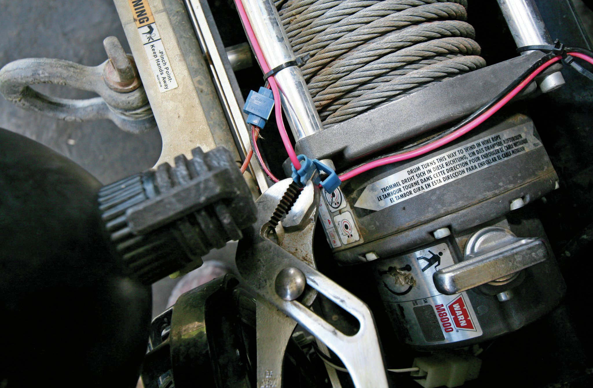 Here is how these nasty things install: You squeeze a piece of metal into the wire surrounded by a piece of plastic. The metal pierces both wires you are connecting. As a nice added bonus, it cuts both wires a little bit. Oh, and it cuts the insulation of the wires too. No, really it’s a great way to connect wires, especially in a Jeep where you guys are bouncing down trails 1,000 miles from nowhere for days on end.