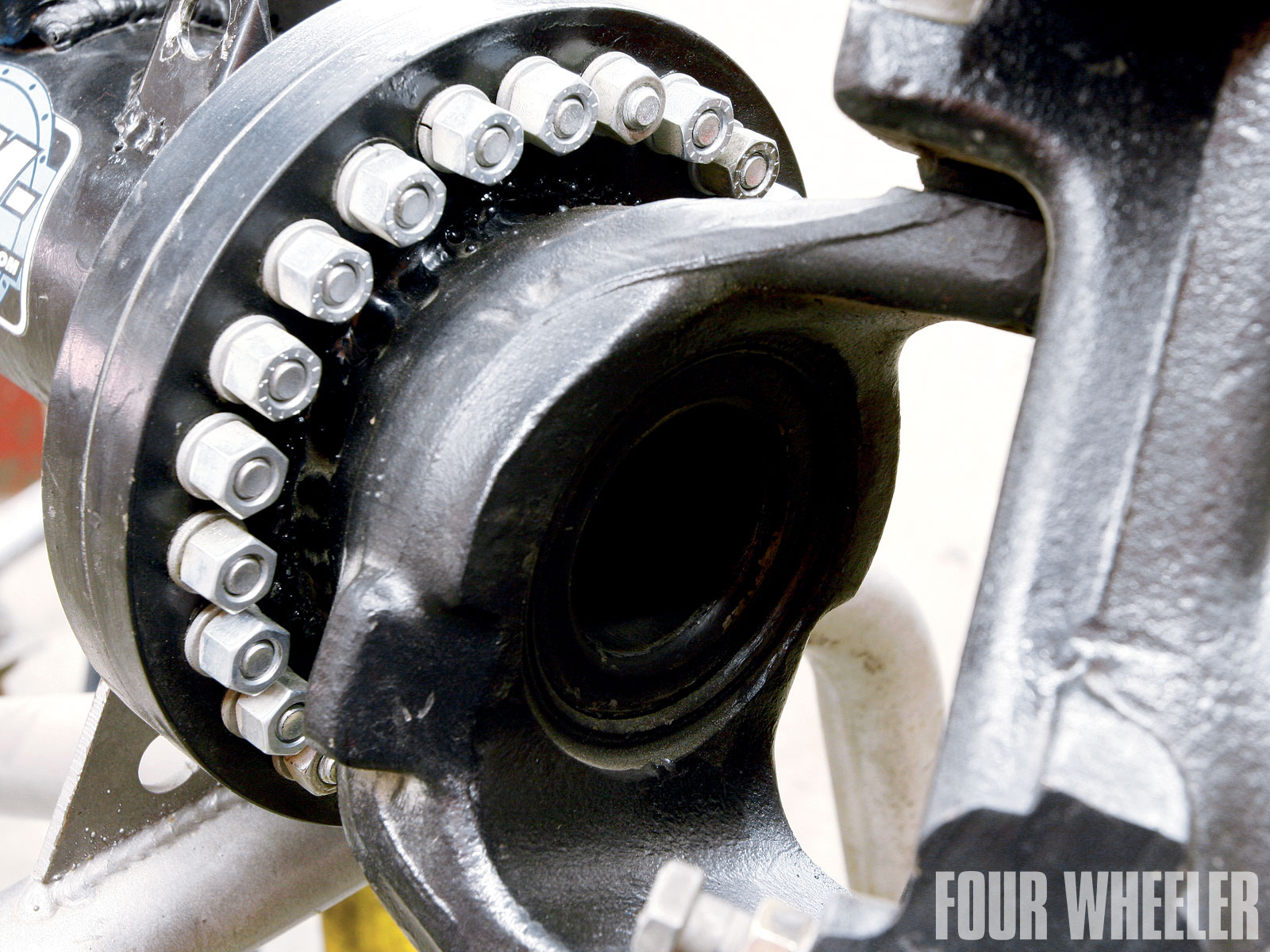 A tube was welded onto each knuckle, and they slide inside the Dana 80 axletubes. This adds strength to the assembly. To adjust the knuckle, you remove the flange bolts, rotate the knuckle to where you need it, and then reinstall the bolts.