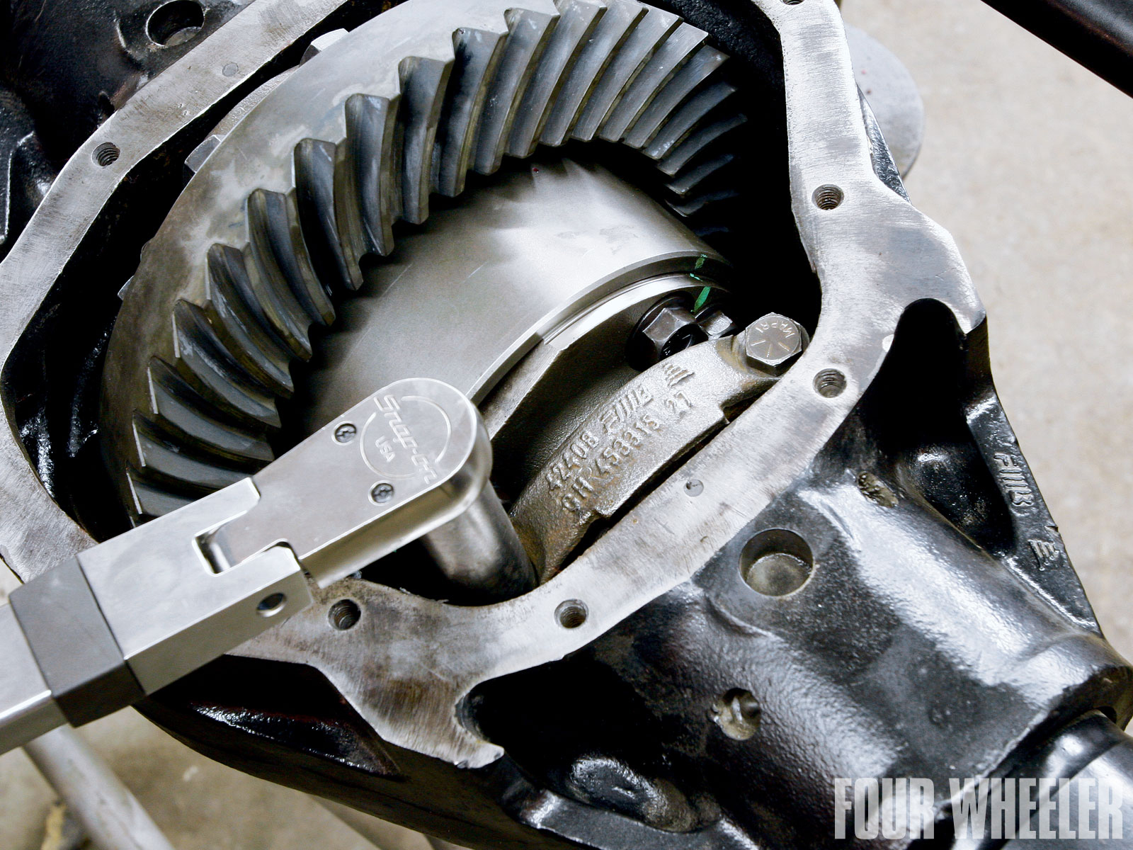 With the new Yukon bearings pressed onto the Truetrac and the new Yukon ring gear mounted using the twelve new 1/2-inch bolts, the unit was bolted into the housing and the pattern checked.