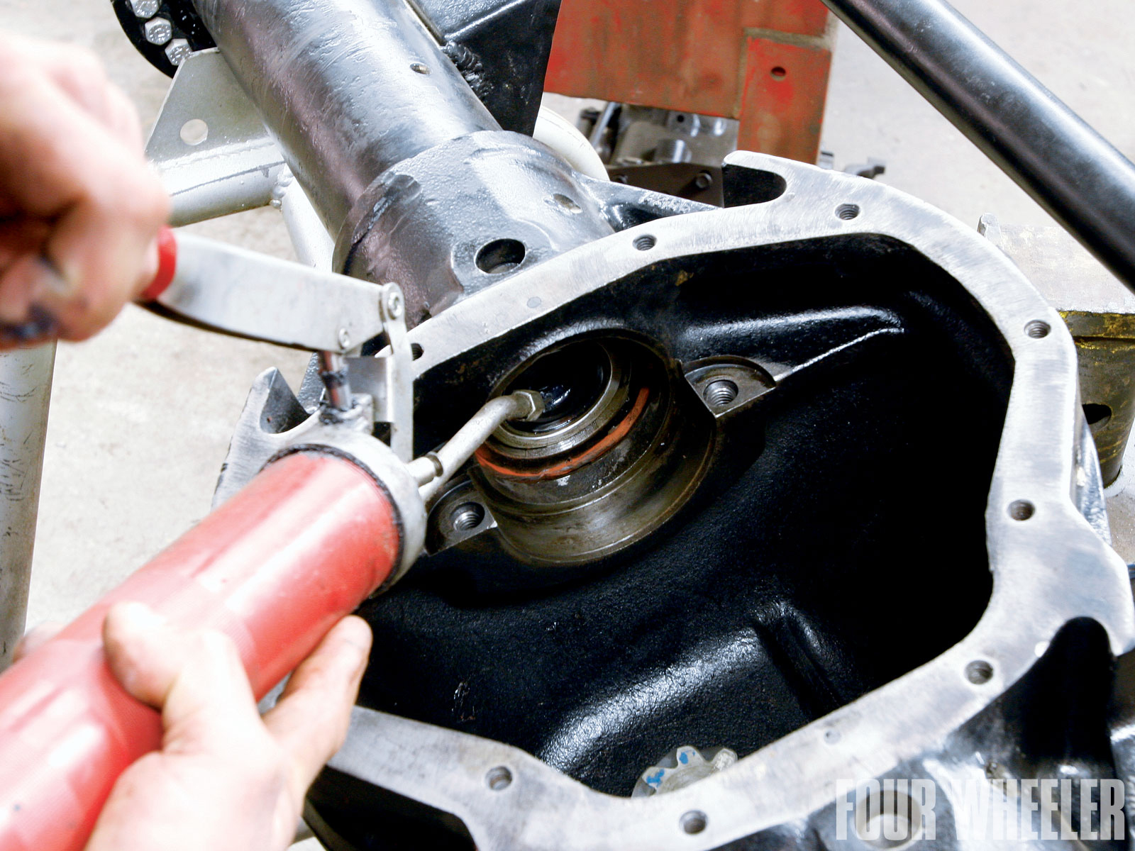 Assembling the centersection of the Dana 80 is similar to other Dana axles. Custom Diff applies grease to the inner axle seals and the ends of the axleshafts to ensure that there's less chance of damage to the seals as the axleshafts are installed.