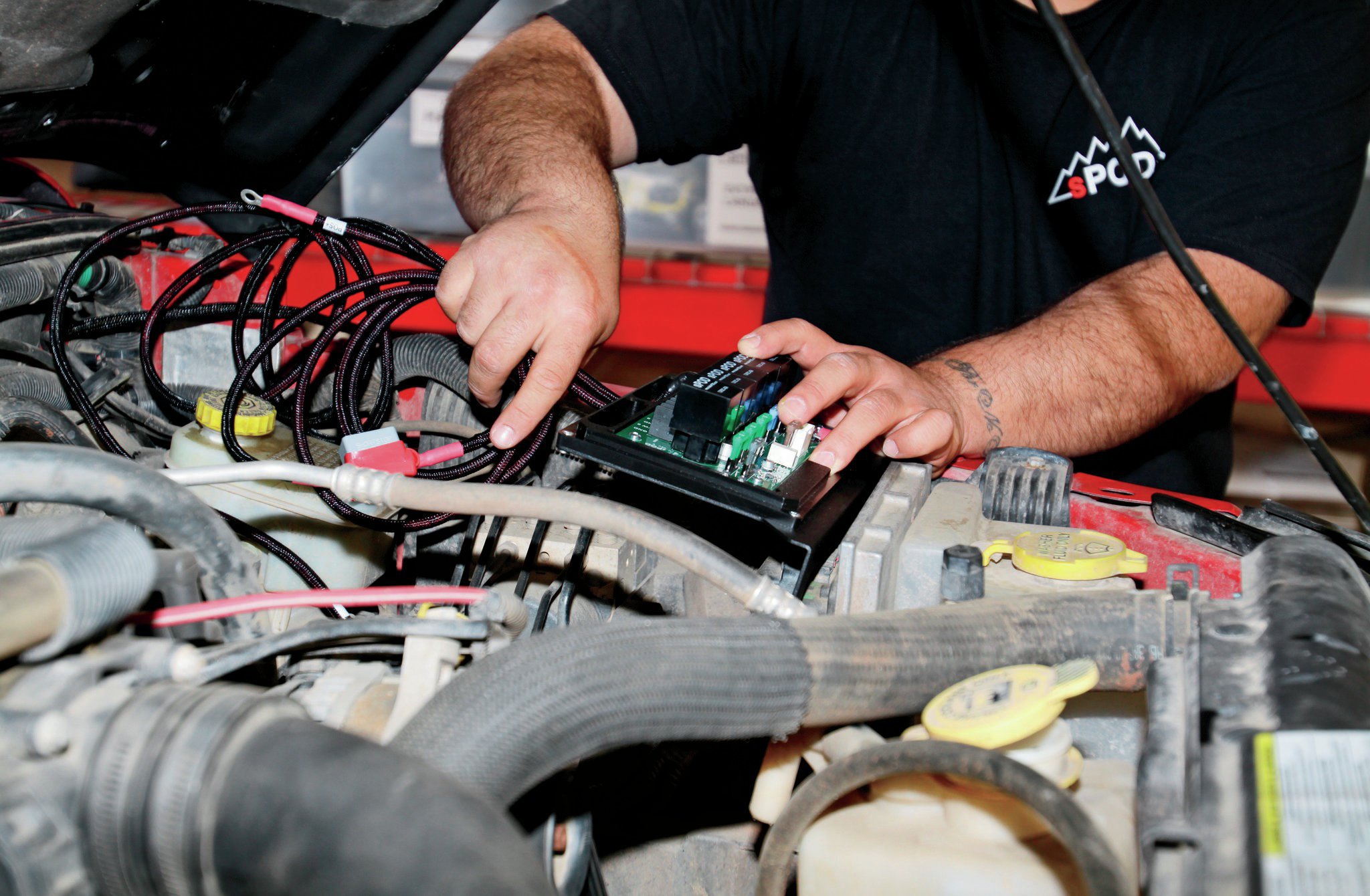 The control box gets mounted on the drivers side under the hood and bolts right to the JK engine-control computer location.
