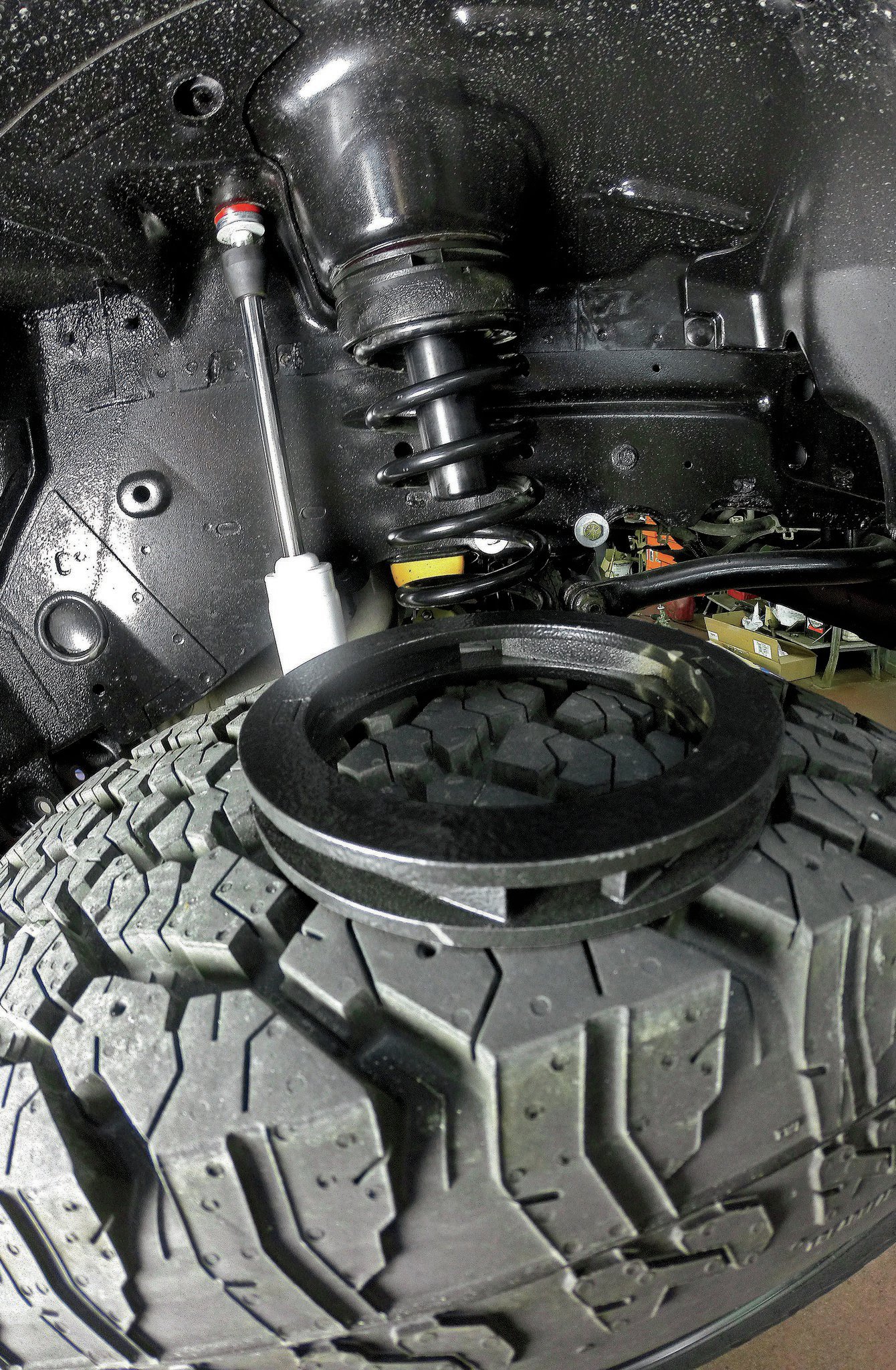 With a considerable amount of additional weight now hanging off the front end of our WJ, we compensated for spring-sag with a pair of Rough Country 3⁄4-inch coil spacers. Thanks to the impressive amount of axle droop that the IRO long-arm suspension offers, we were able to yank the coil springs out by hand and install the spacers in a matter of minutes. The Jeep still has a noticeable front-end rake, but the spacers did the trick for now; higher-rate coils may be in our future, however.