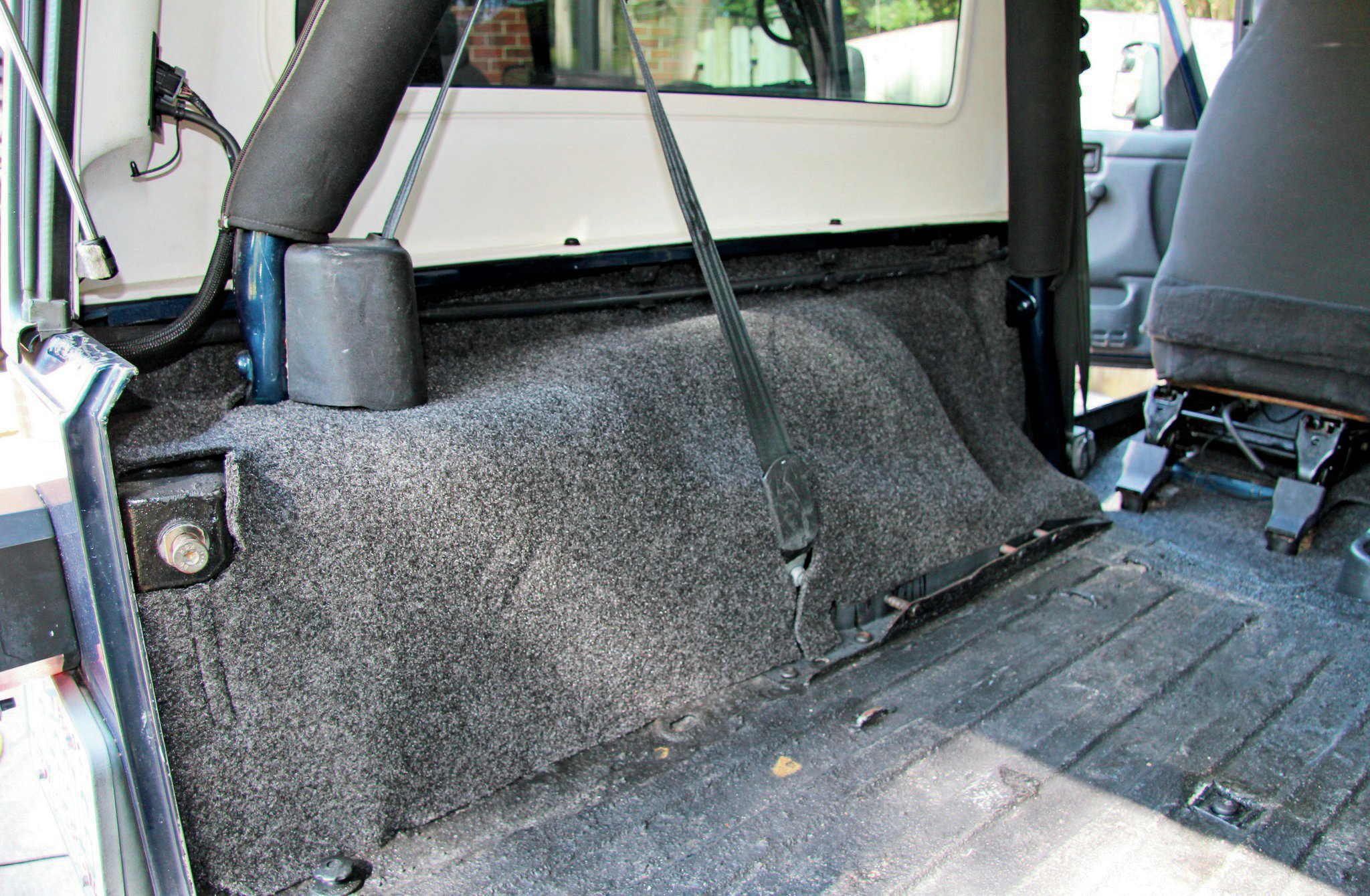 We got to guinea-pig BedRug’s new Unlimited LJ kit and were stoked that it fit without any issues. The sides of the rug install first and simply slide behind the seatbelts. All necessary notches and openings were already in place.