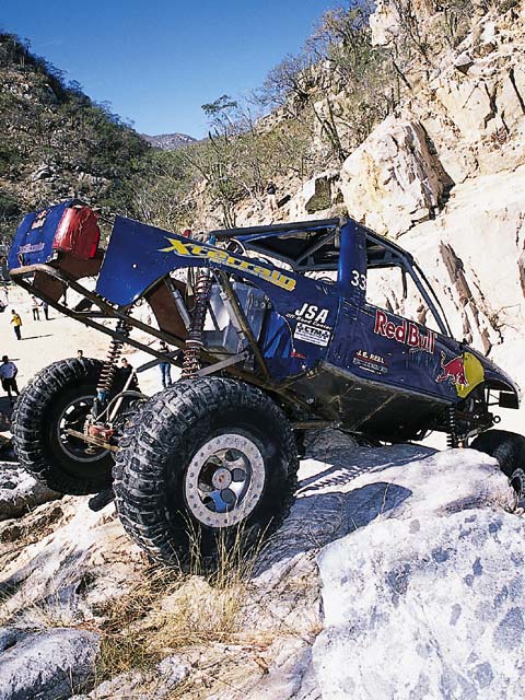 A one-time competition cliff diver, Dustin Webster now gets his thrills on the rock course in his Red Bull-sponsored '01 Chevy S-10 rockcrawler.