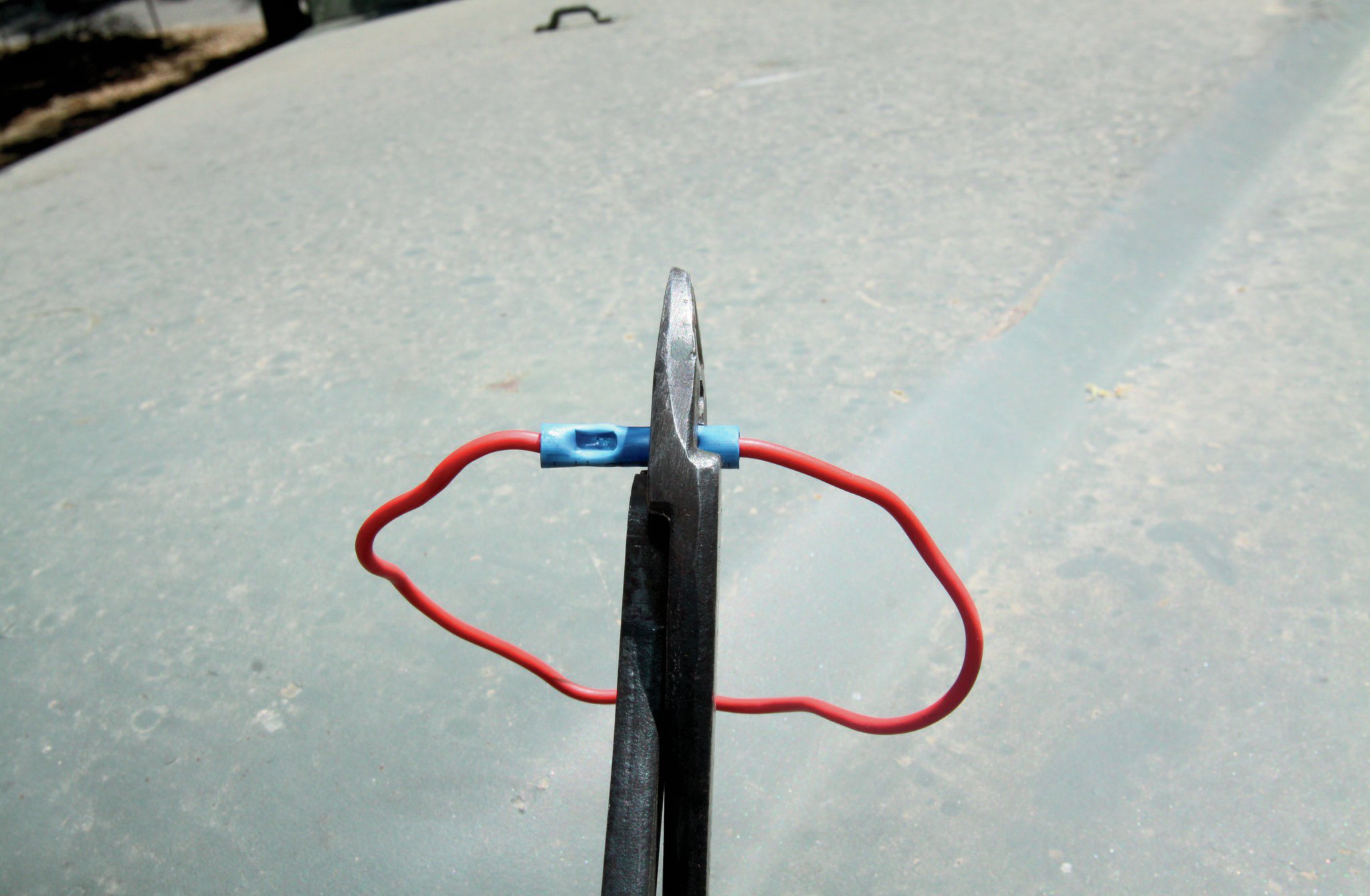 The key to a good crimper is mostly in its thickness. This one is 1⁄4-inch-thick. The reason that is important is because the more wire that is squished down inside that little butt connector, the better the actual electrical connection. Also, I’ve found that by using a crimper like this, the wires break less than if I use a cheaper, narrower crimper.