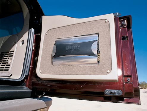 Filling the huge cabin with sound is a custom-designed Bazooka stereo system. The two amplifiers have been mounted in the rear doors so as not to use up interior space.