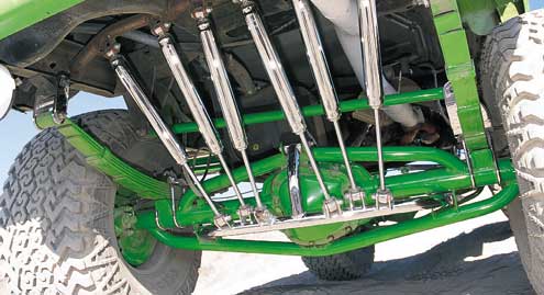 In the rear, the stock Ford 10.25-inch axle was used but reconfigured for a 5-on-5 1/2-inch bolt pattern. Eight-inch Superlift packs replaced the stock coils and were located by custom hangers and shackles. Chris built the impressive shock mount system himself.