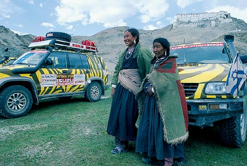 Khampa women shied away from our cameras. That’s a view of the monastery Kye perched strategically in the distance.