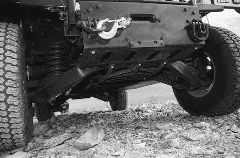 OK, so the Hummer has a whopping 11 inches of minimum ground clearance. Big deal. You can’t lift it, it rides like a tank, and it handles like a Topkick delivery truck. We did like the skidplates though. Don’t forget about the $2,688 winch option. (You’ve got to be kidding).