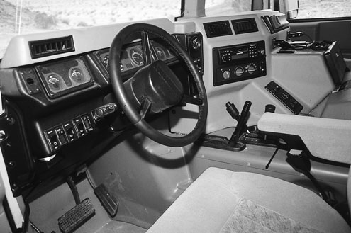 We liked the cockpit-style seating of the Hummer but the layout made it impossible for other passengers to adjust the heater controls or the stereo. Speaking of the heater, we could never really get it to warm up. Our TJ with a soft top was way warmer inside and the heater worked.