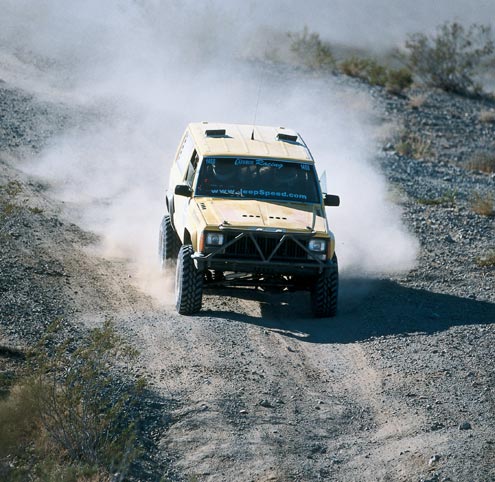 Casey Currie and the rest of the kids from Currie Enterprises race a two-door Cherokee with a heavily trussed Dana 44 up front and a Ford 9-inch out back. The rules require the rest of the drivetrain to remain all-Jeep.