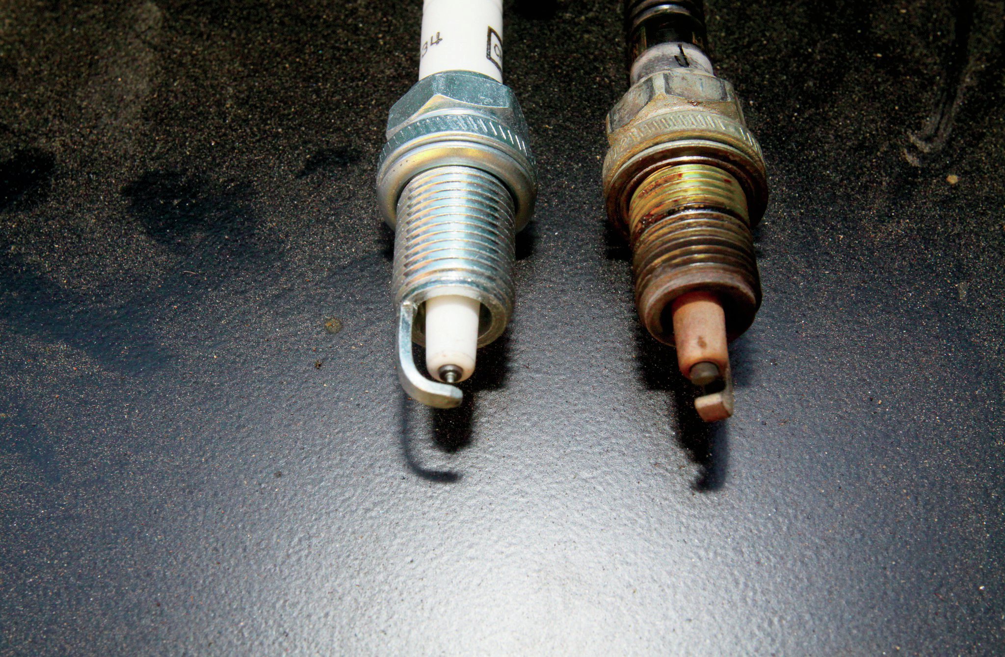 Since we had the new parts from DUI, we decided to go ahead and swap plugs too. While we do like the fancier plugs, when we use a DUI coil, we always just go with the regular Champion plugs (especially in a Jeep with 258,000 miles).